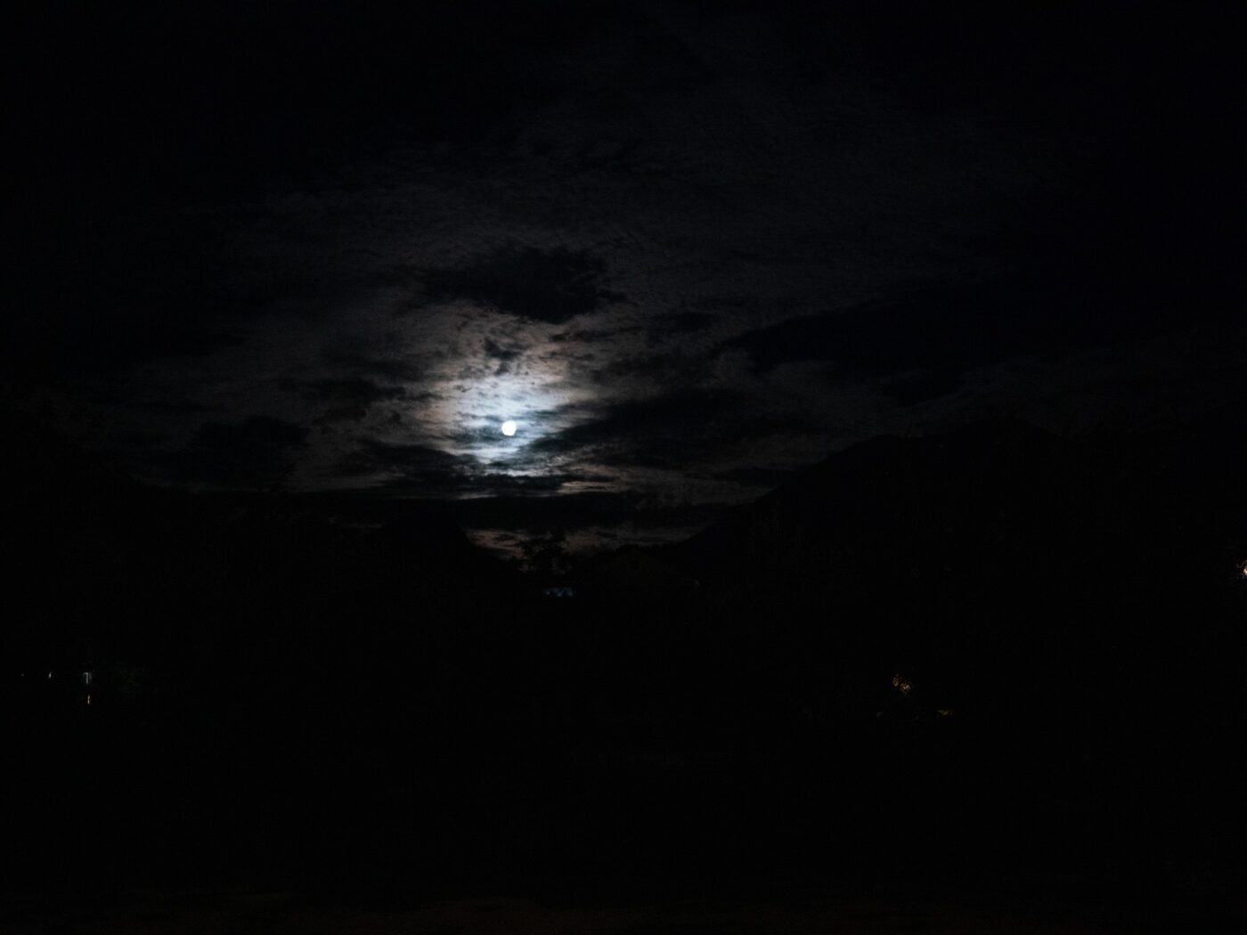 Full moon shining through clouds in a dark night sky – poetic nocturnal scene - nbcreations