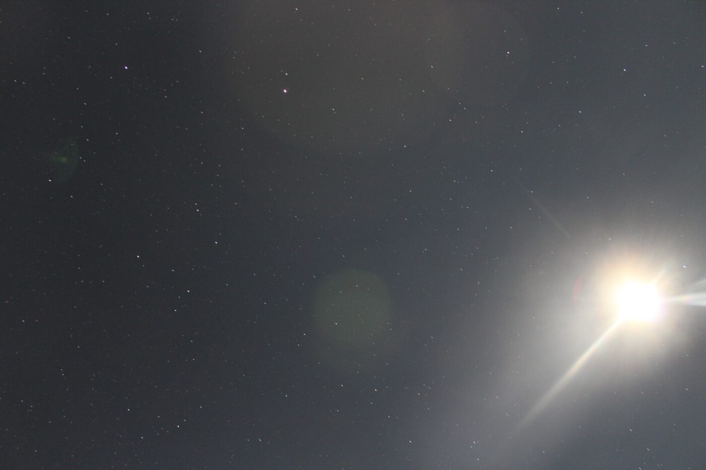 Full moon with shining lunar rays and a starry sky in the background – celestial nightscape - nbcreations
