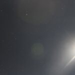 Full moon with shining lunar rays and a starry sky in the background – celestial nightscape - nbcreations