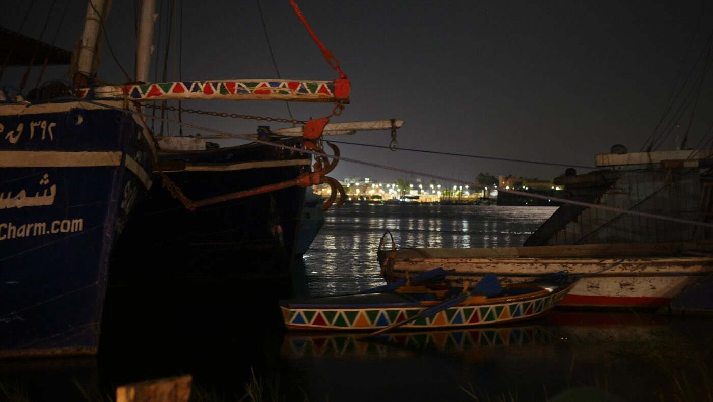 Traditional boats moored on the Nile at night – Egyptian river scene - nbcreations