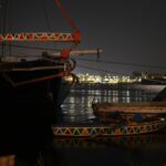 Traditional boats moored on the Nile at night – Egyptian river scene - nbcreations