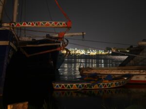 Traditional boats moored on the Nile at night – Egyptian river scene - nbcreations