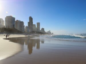 Paradise Surfer beach in Australia with city skyline in the background – urban coastal view - nbcreations