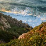 Aerial view of a cliff above the sea – top-down coastal perspective - nbcreations