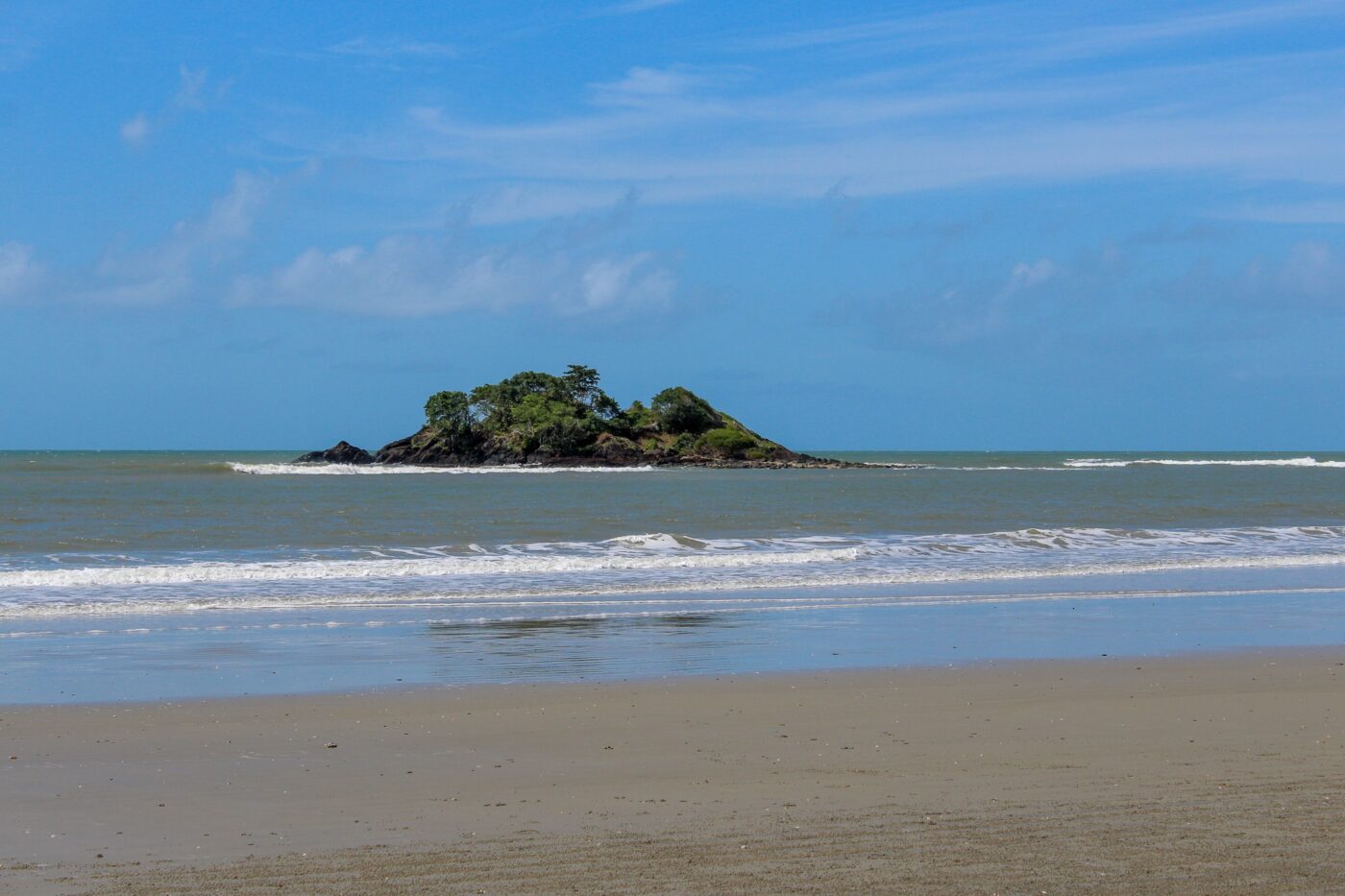 Small island seen from a sandy beach – coastal seascape view - nbcreations