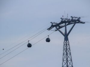 Cable car support tower with cables stretching into the distance – aerial lift infrastructure - nbcreations
