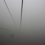 Cable car suspended in thick fog – atmospheric aerial transport - nbcreations