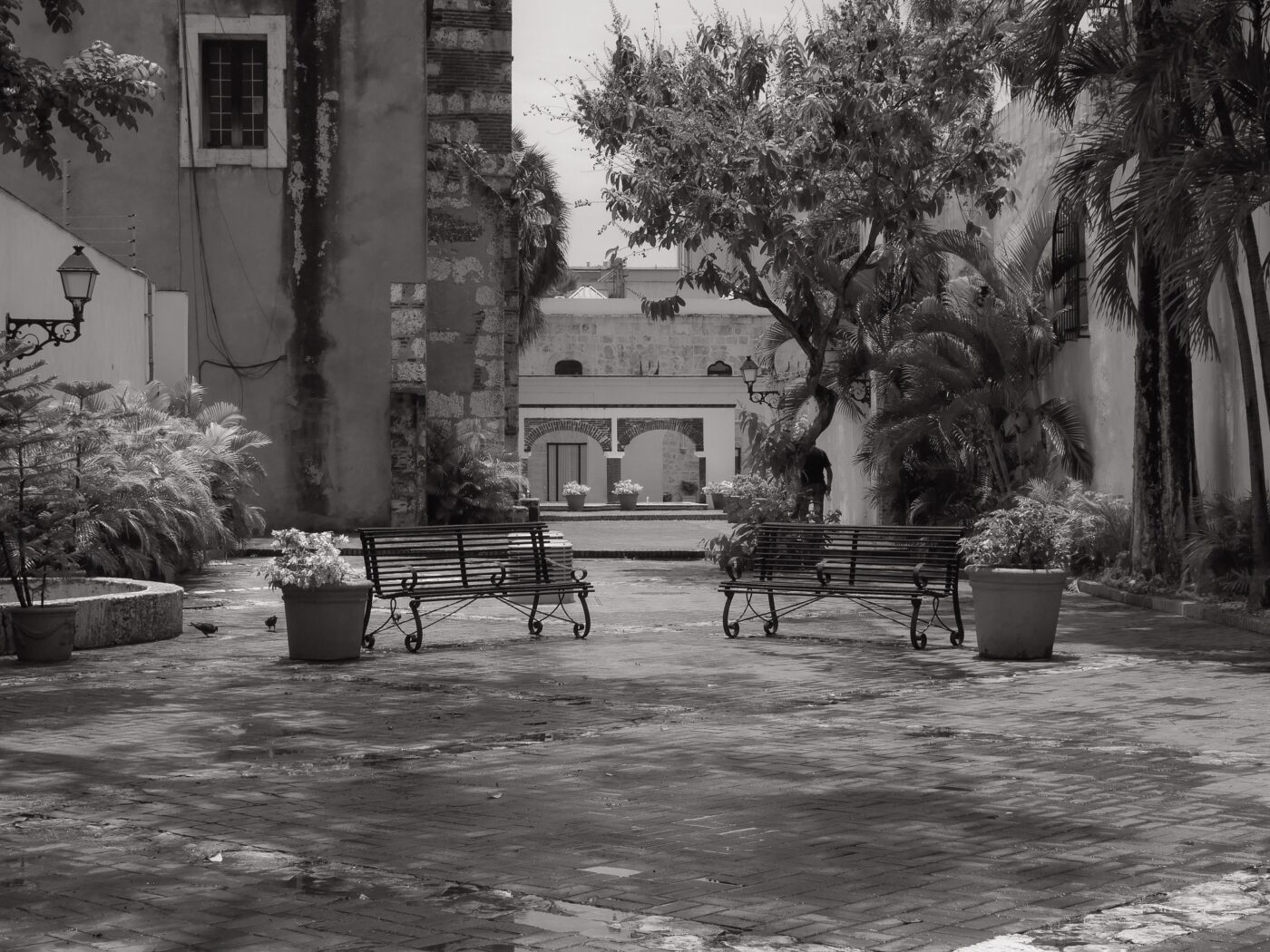 Quiet town square with empty benches and surrounding buildings – peaceful urban space - nbcreations