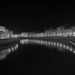 Night view of city bridge with illuminated buildings over river – urban evening scene - nbcreations
