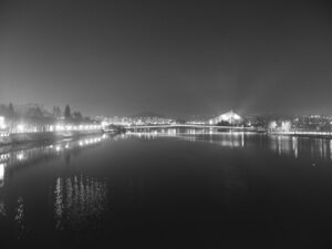 City bridge illuminated at night with reflections on the water – urban nightscape - nbcreations