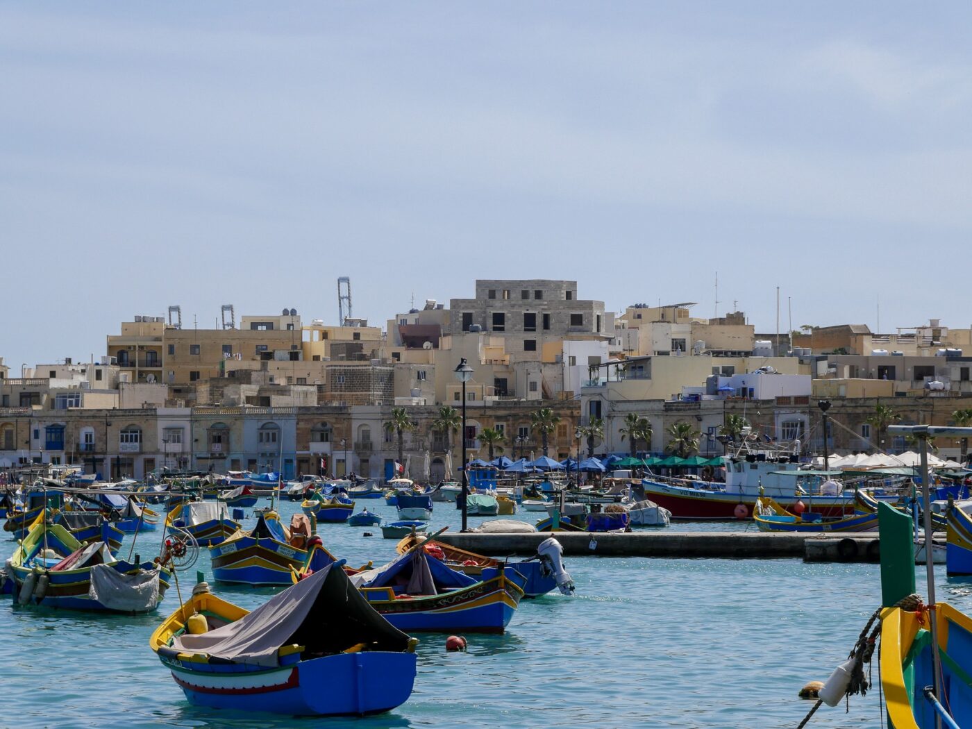 Village harbor in Malta with many small boats moored – Mediterranean coastal scene - nbcreations
