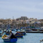 Village harbor in Malta with many small boats moored – Mediterranean coastal scene - nbcreations