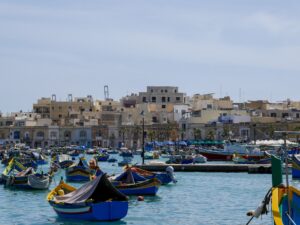 Village harbor in Malta with many small boats moored – Mediterranean coastal scene - nbcreations