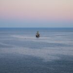 Historical sailing ship on calm sea – exploration-era vessel silhouette - nbcreations