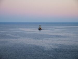 Historical sailing ship on calm sea – exploration-era vessel silhouette - nbcreations