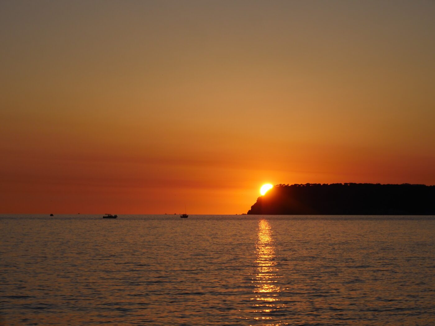 Sunset view over calm ocean waters nbcreations