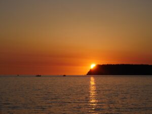 Sunset view over calm ocean waters nbcreations