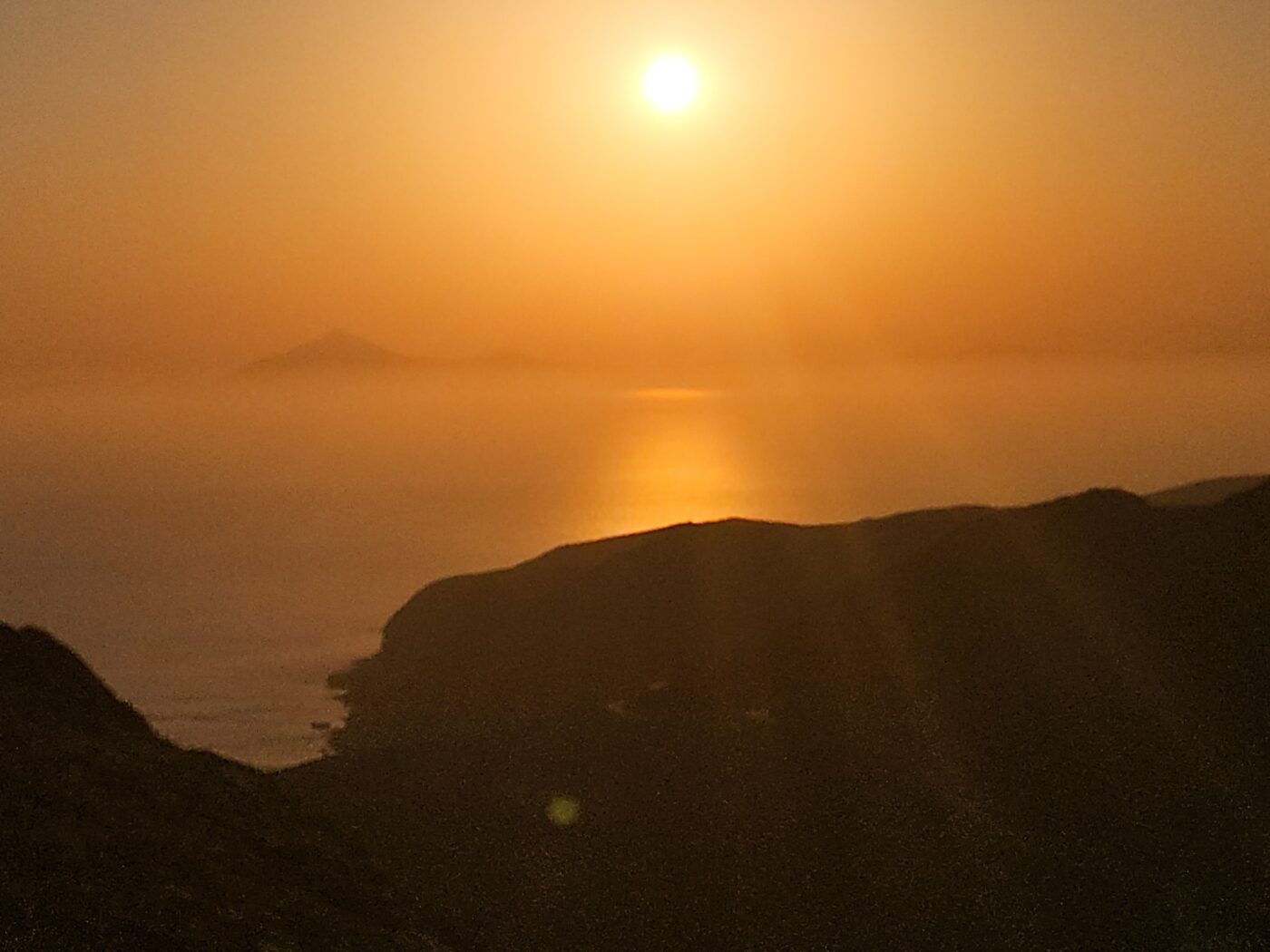 Golden sunset over calm ocean horizon nbcreations