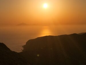 Golden sunset over calm ocean horizon nbcreations