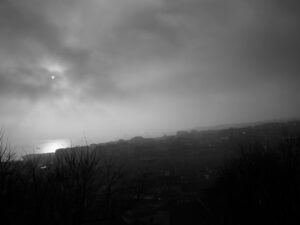 black and white Foggy landscape at sunrise over city NBCcréations