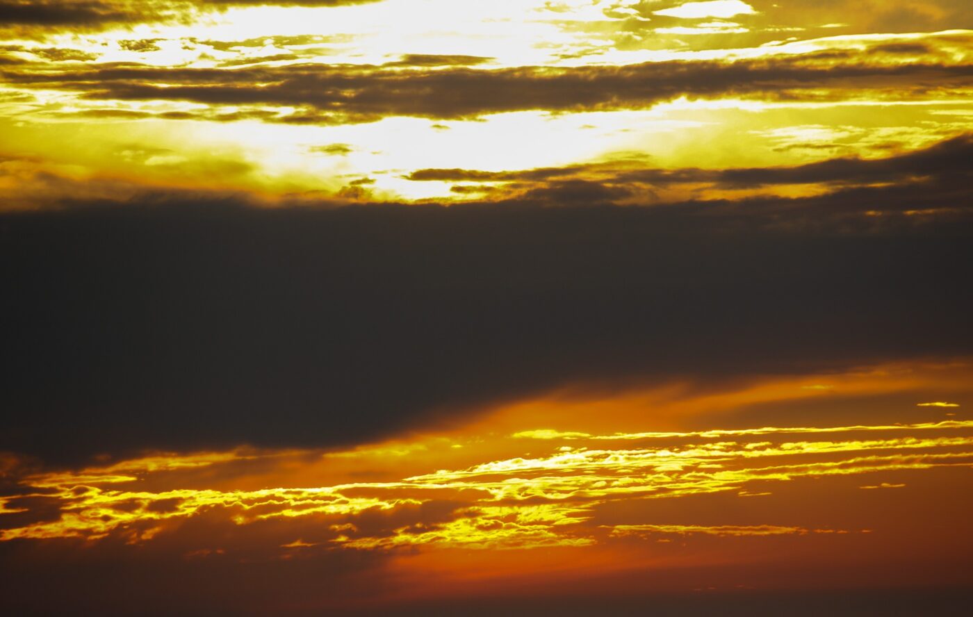 golden sunset sky with dense black clouds – nbcreations