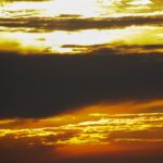 golden sunset sky with dense black clouds – nbcreations