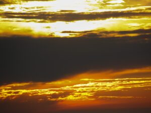 golden sunset sky with dense black clouds – nbcreations