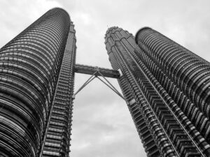 Petronas Towers photographed from below – modern skyline view - nbcreations