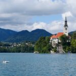Church on the island of Lake Bled with a swan on the water – nbcreations