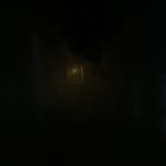 Dimly lit lantern at the end of a dark, misty corridor – mysterious nocturnal scene - nbcreations