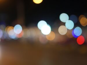 Abstract image of colorful city lights blurred at night.- nbcreations