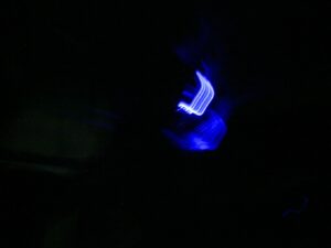Abstract photo with blue neon light on a black background. - nbcreations