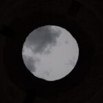 View of cloudy sky forming a moon-like circle – artistic visual illusion - nbcreations