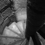 Ancient stone spiral staircase with a rough central column, viewed from above – nbcreations